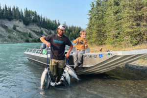 Father son holding a stringer of Sockeye salmon on the Kenai River